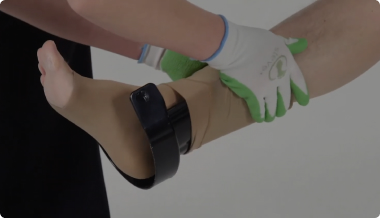 Donning compression socks on a patient